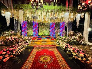 floral decor, grand stage decor, thematic setup, outdoor stage setup