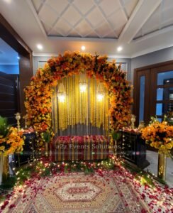 floral backdrop, hanging chandeliers, bridal campaign decor, indoor thematic setup