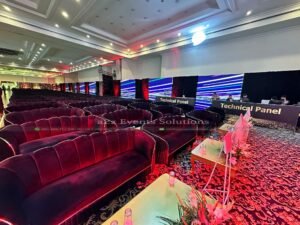 sofa sitting, corporate setup, multimedia panels, indoor decor