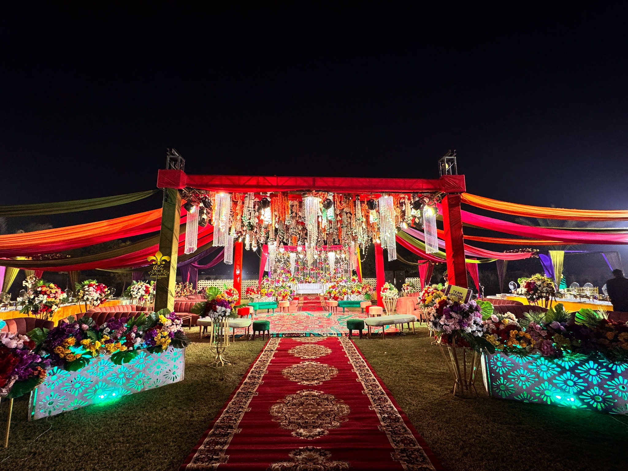 grand wedding setup, multicolored decor, mehndi event setup, caterers