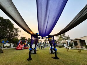 open-air-birthday-party boss baby theme, balloon decor, catering setup, events designers