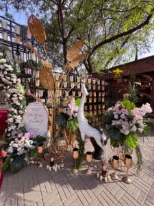entrance setup, daytime wedding, outdoor event, floral decor