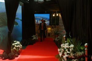 entrance setup, red carpeting, floral decor, corporate meeting