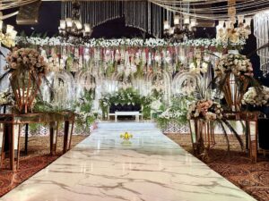 console tables, marble walkway, area decor, hanging chandeliers