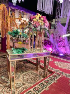 wedding-management console table, floral decor, walkway setup, caterers