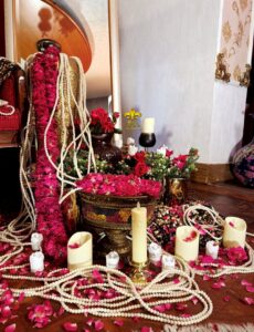 crystal beaded decor, candles, fresh flowers, indoor bridal makeup campaign shoot set