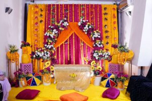intimate-mayoun-stage home based ceremony, wedding management, dholak setup, floral backdrop