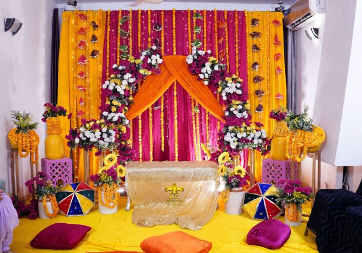 home based ceremony, wedding management, dholak setup, floral backdrop
